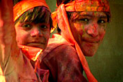 playing Holi and waving