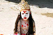 Small kid has done make up and looking like Shiva God,